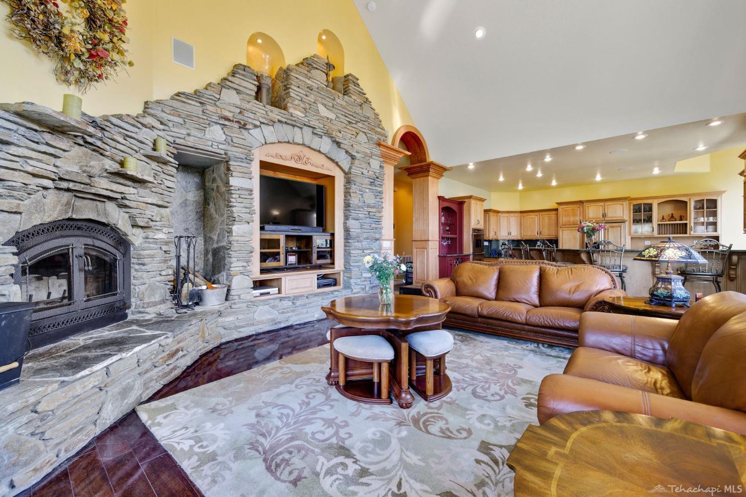 24500 Heather Court Tehachapi, CA 93561 - Photo 14 of 60 a living room with furniture and a fireplace