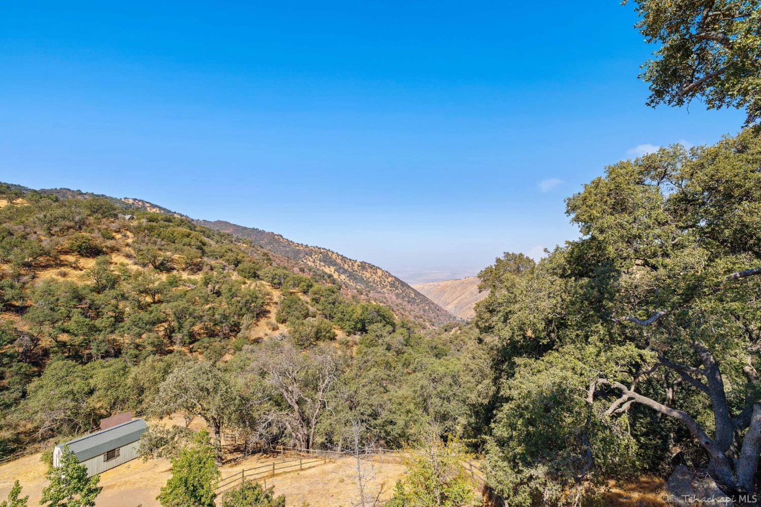 24500 Heather Court Tehachapi, CA 93561 - Photo 18 of 60 a view of a large mountain with mountains in the background