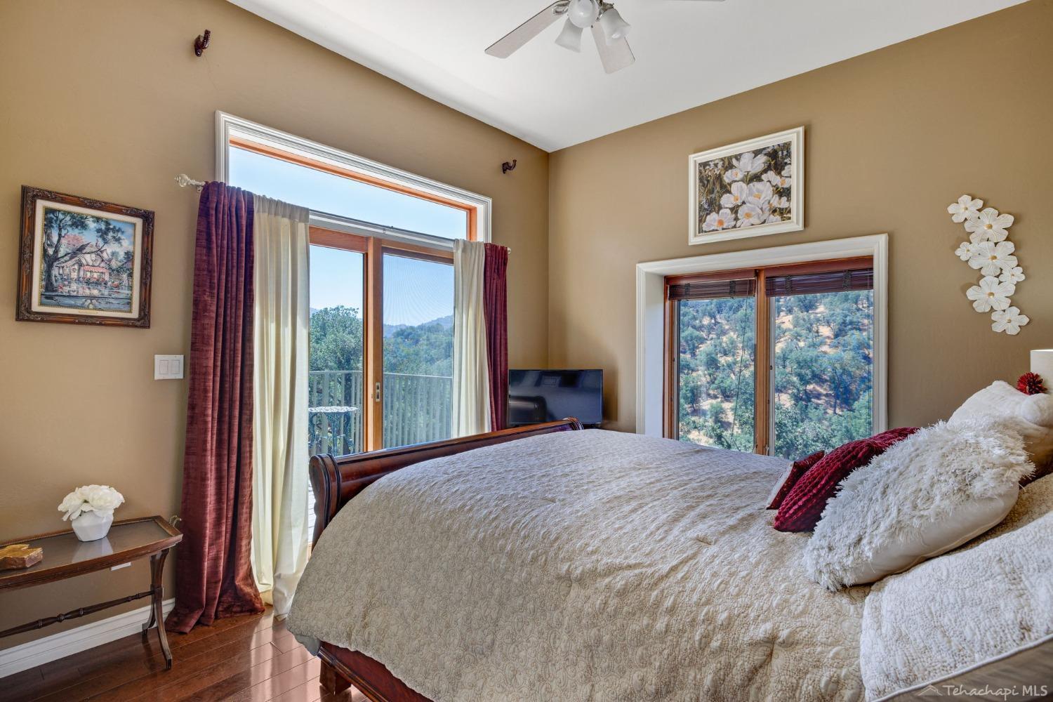 24500 Heather Court Tehachapi, CA 93561 - Photo 39 of 60 a bedroom with a bed and a window