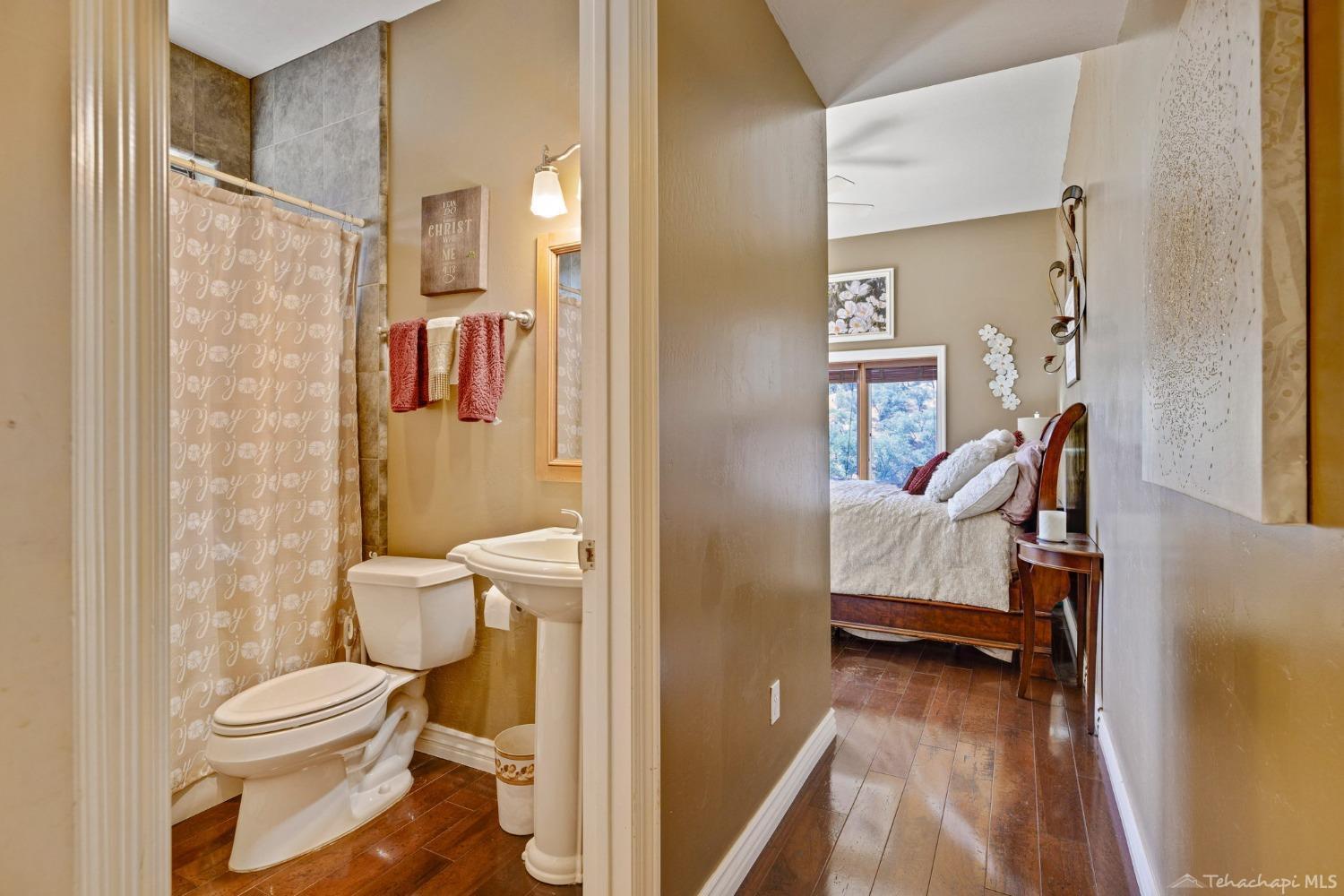 24500 Heather Court Tehachapi, CA 93561 - Photo 41 of 60 a bathroom with a toilet and a shower