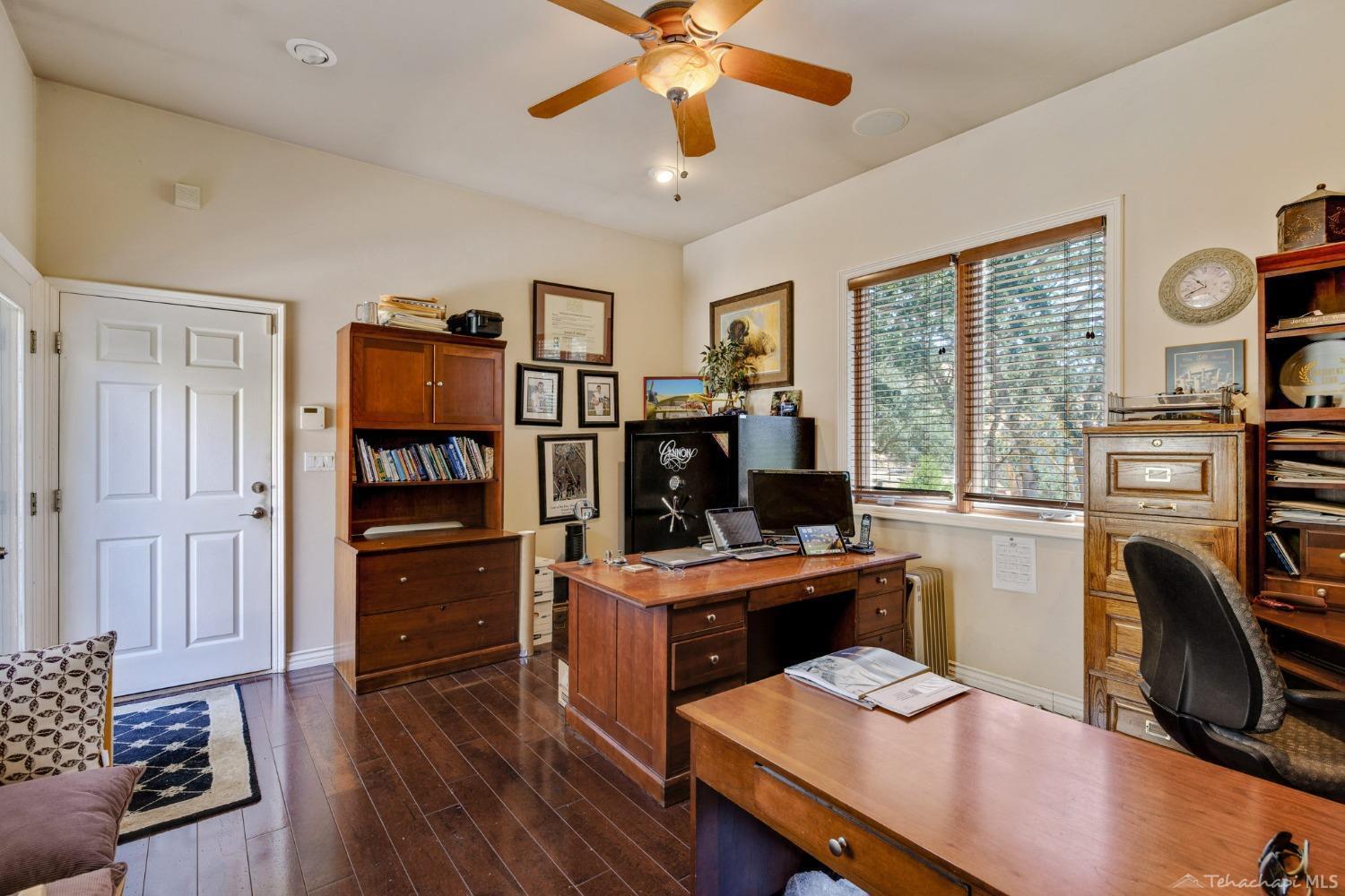 24500 Heather Court Tehachapi, CA 93561 - Photo 42 of 60 a view of a workspace with furniture and a window