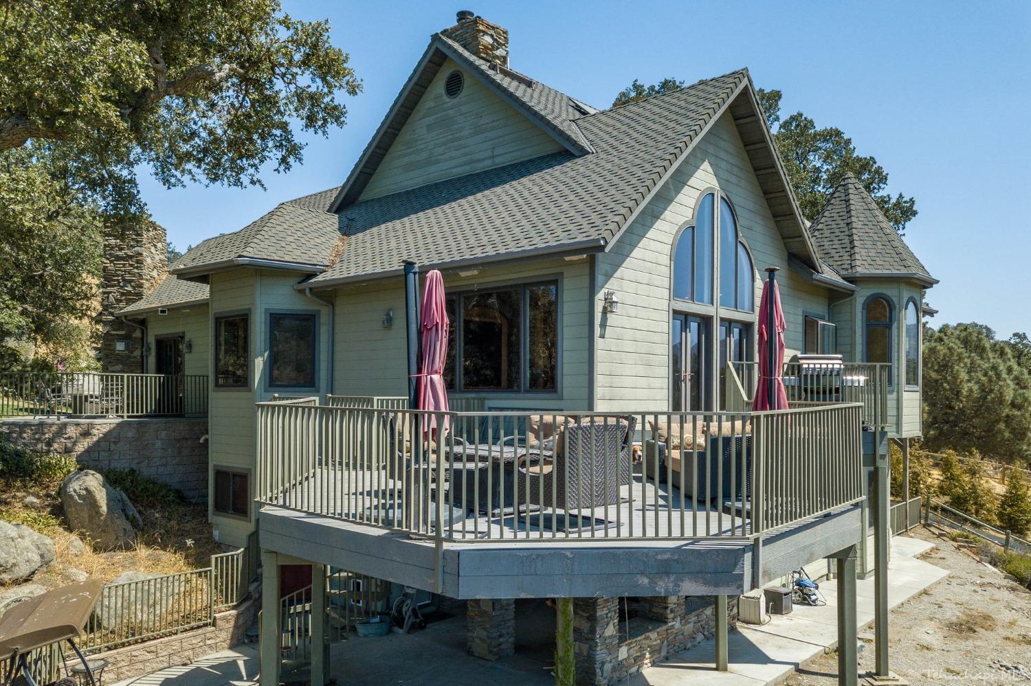24500 Heather Court Tehachapi, CA 93561 - Photo 51 of 60 a view of a house with a deck and furniture