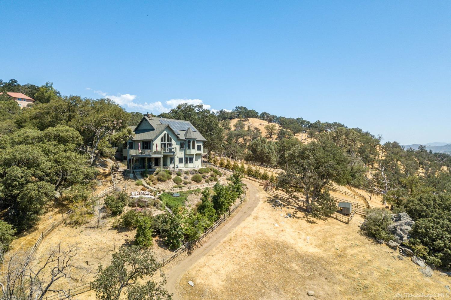 24500 Heather Court Tehachapi, CA 93561 - Photo 52 of 60 a view of a yard with a house