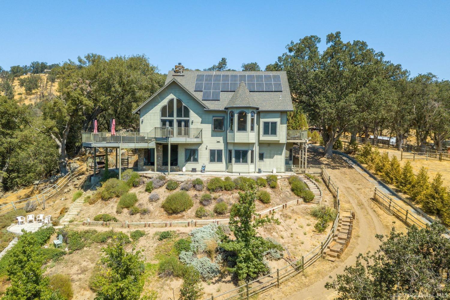 24500 Heather Court Tehachapi, CA 93561 - Photo 6 of 60 a front view of a house with a yard