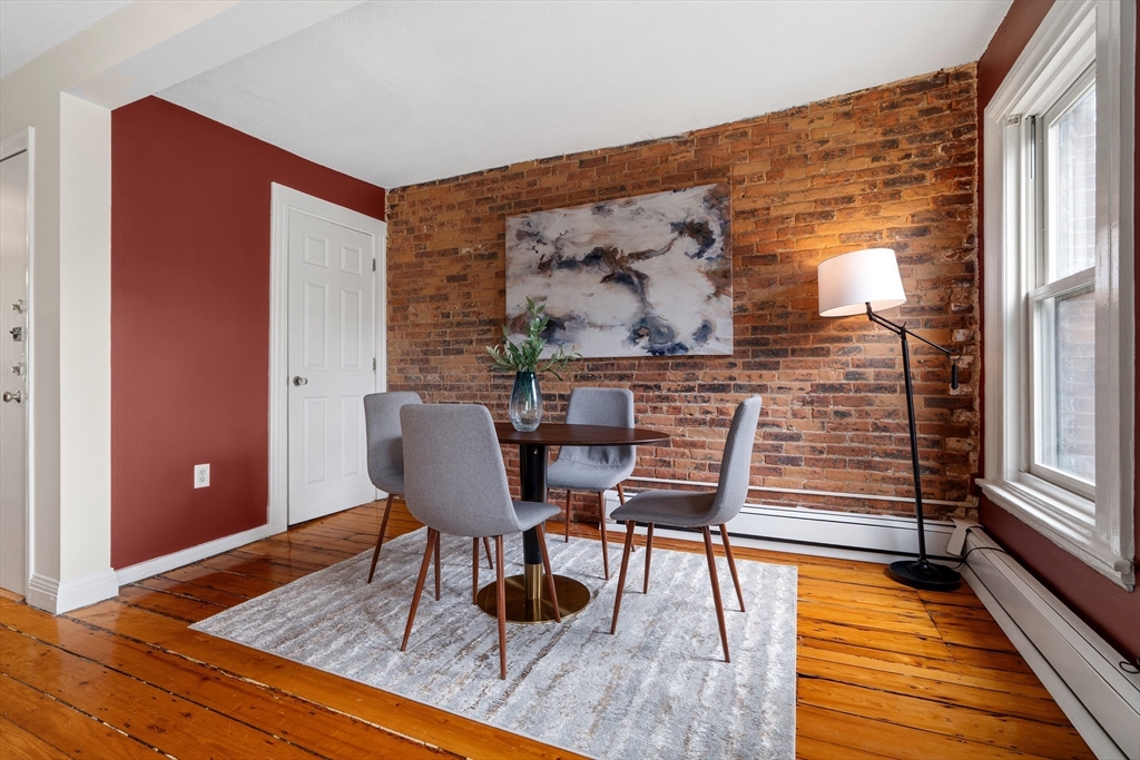 88 West Springfield Street, Unit 3 Boston, MA 02118 - Photo 8 of 17 a dining room with furniture and wooden floor