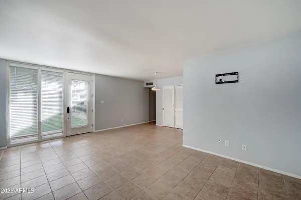 a view of an empty room with a window