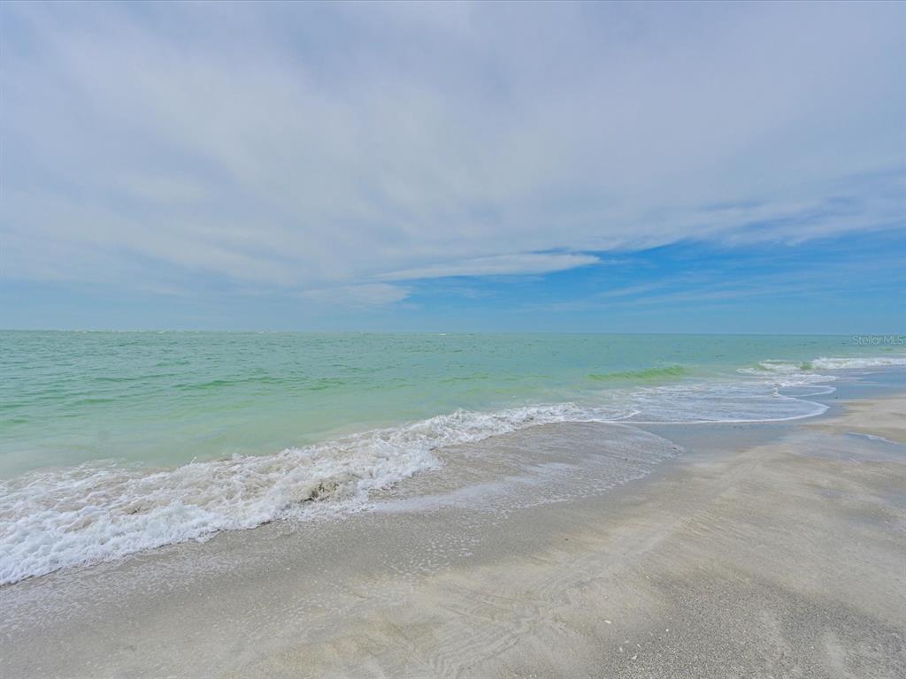 100 Sands Point Road, Unit 225 Longboat Key, FL 34228 - Photo 27 of 32 a view of a beach with an ocean view