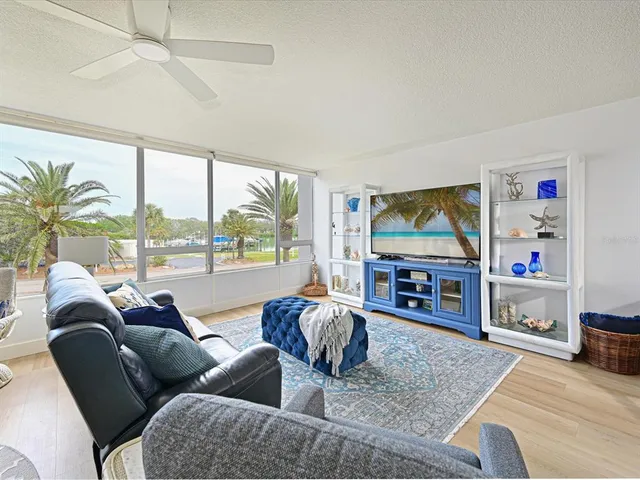 a living room with fireplace furniture and a flat screen tv