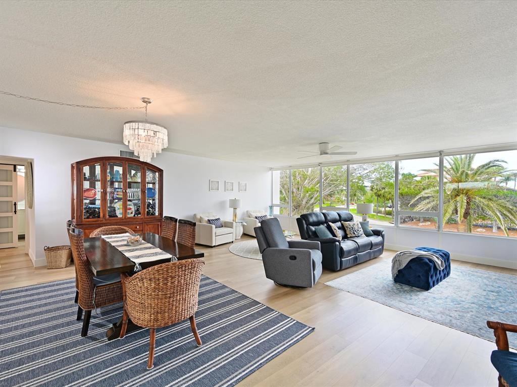 100 Sands Point Road, Unit 225 Longboat Key, FL 34228 - Photo 7 of 32 a living room with furniture and a large window