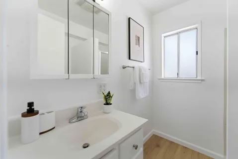 a bathroom with a sink and a mirror