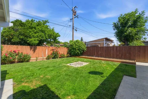 a backyard of a house with lots of green space