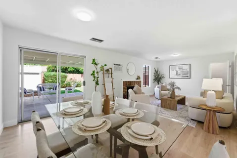 a living room with furniture and a table