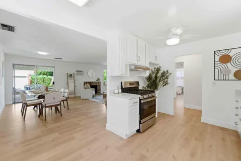 a kitchen with a table and chairs in it