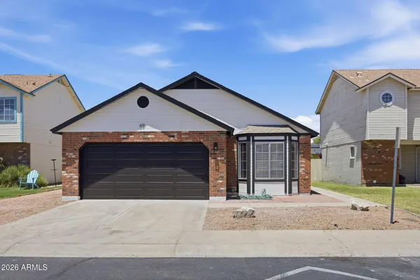 a front view of a house with a garage