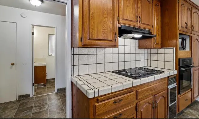 a kitchen with a stove and a microwave