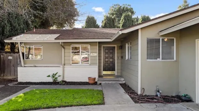 a front view of a house with a yard