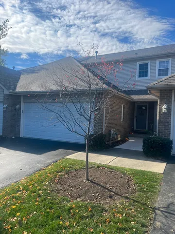 a house view with a backyard space