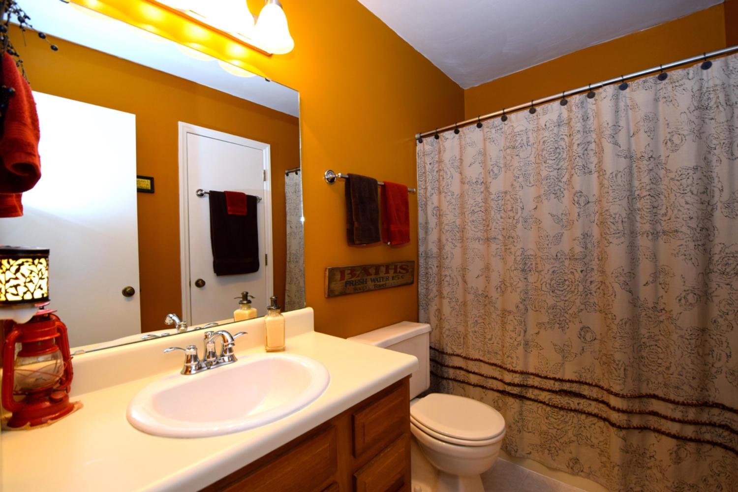 3323 Forest Ridge Road Roanoke, VA 24018 - Photo 13 of 23 a bathroom with a granite countertop sink toilet and shower