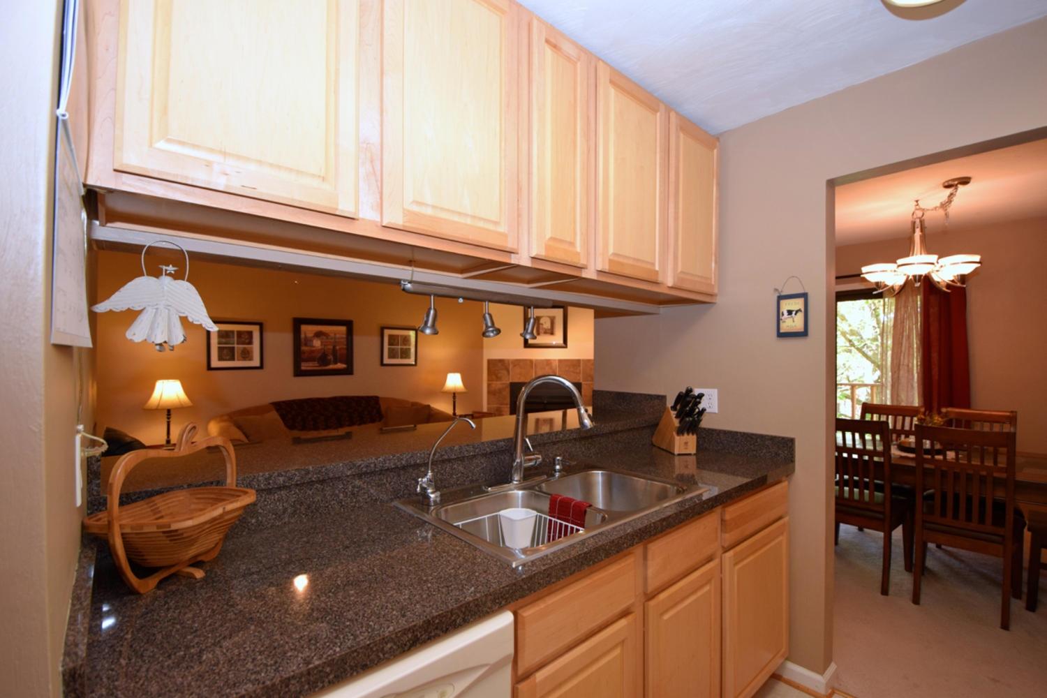 3323 Forest Ridge Road Roanoke, VA 24018 - Photo 8 of 23 a kitchen with a sink and cabinets