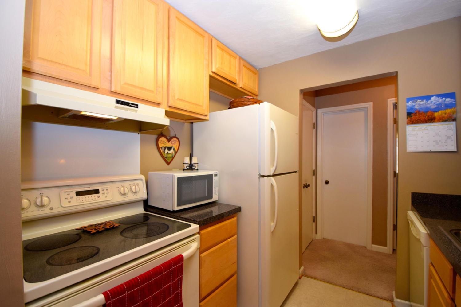 3323 Forest Ridge Road Roanoke, VA 24018 - Photo 10 of 23 a kitchen with a refrigerator and a stove