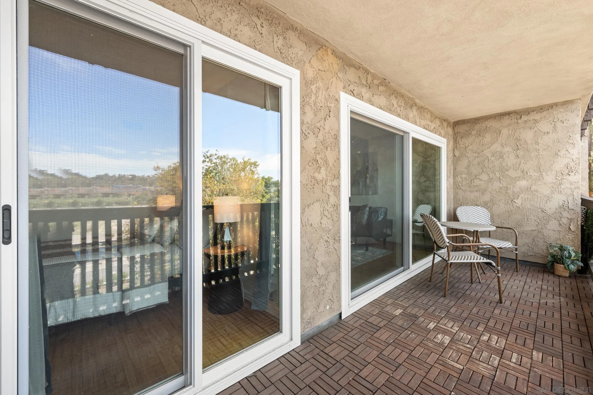 6202 Friars Road, Unit 215 San Diego, CA 92108 - Photo 16 of 18 a view of a balcony with chair and front door