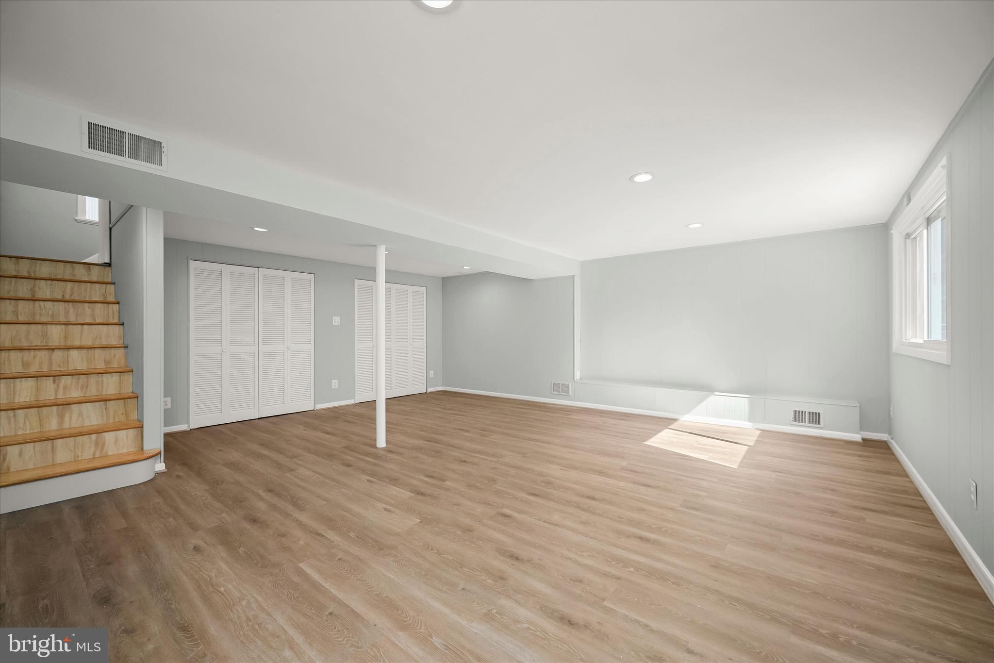 9720 Hedin Drive Silver Spring, MD 20903 - Photo 51 of 79 wooden floor in an empty room with a window