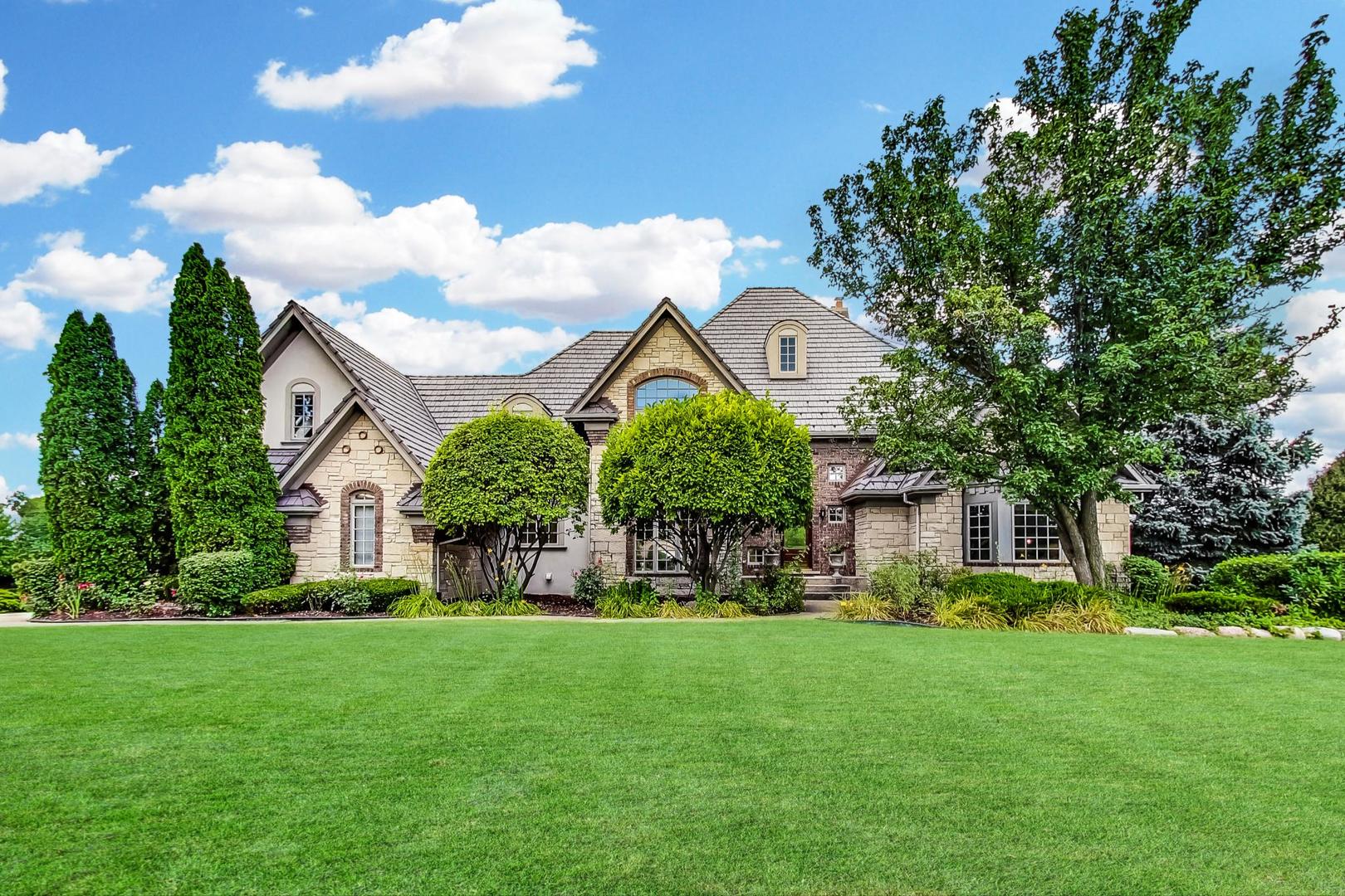 6972 Fieldstone Drive Burr Ridge, IL 60527 - Photo 2 of 2 a front view of a house with garden
