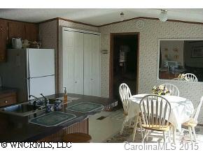 1 Thunder Ridge Road Saluda, NC 28773 - Photo 2 of 5 a dining room with furniture and a mirror