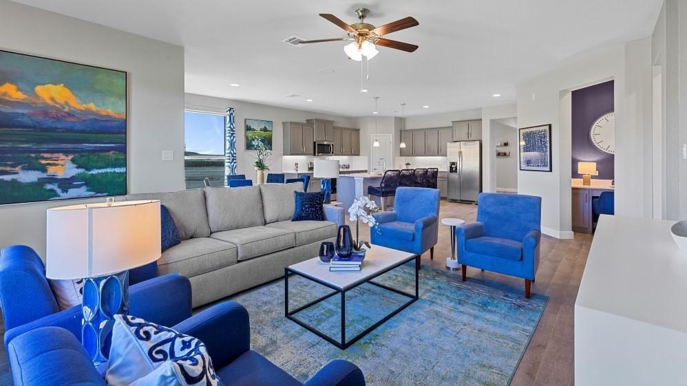 109 Hugo Court Rhome, TX 76078 - Photo 9 of 30 a living room with furniture kitchen view and a chandelier