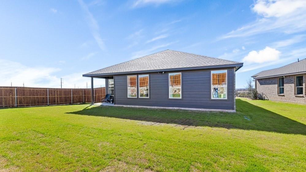 109 Hugo Court Rhome, TX 76078 - Photo 29 of 30 a front view of a house with a yard