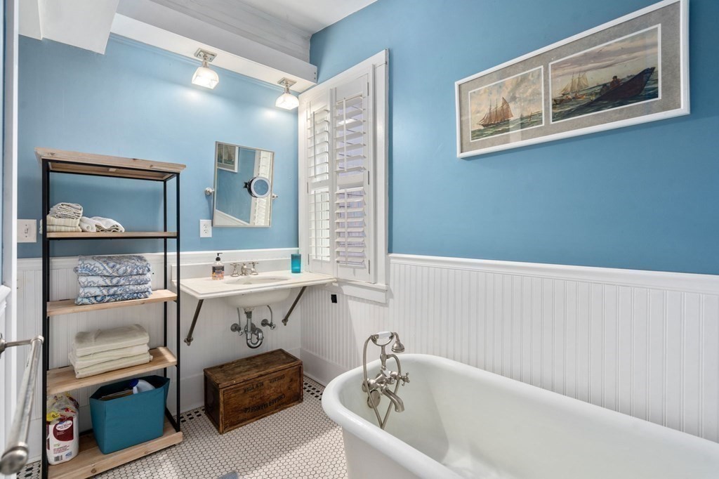 7 North Water Street Wareham, MA 02558 - Photo 17 of 39 a bathroom with a sink and a bathtub