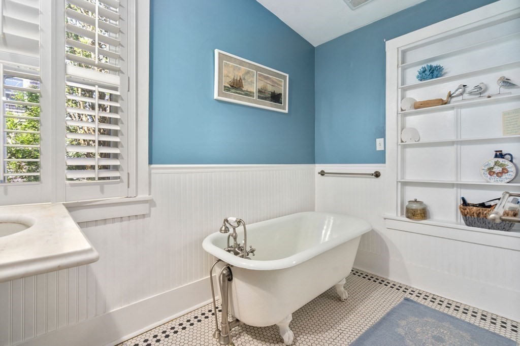 7 North Water Street Wareham, MA 02558 - Photo 18 of 39 a bathroom with a bathtub and a window