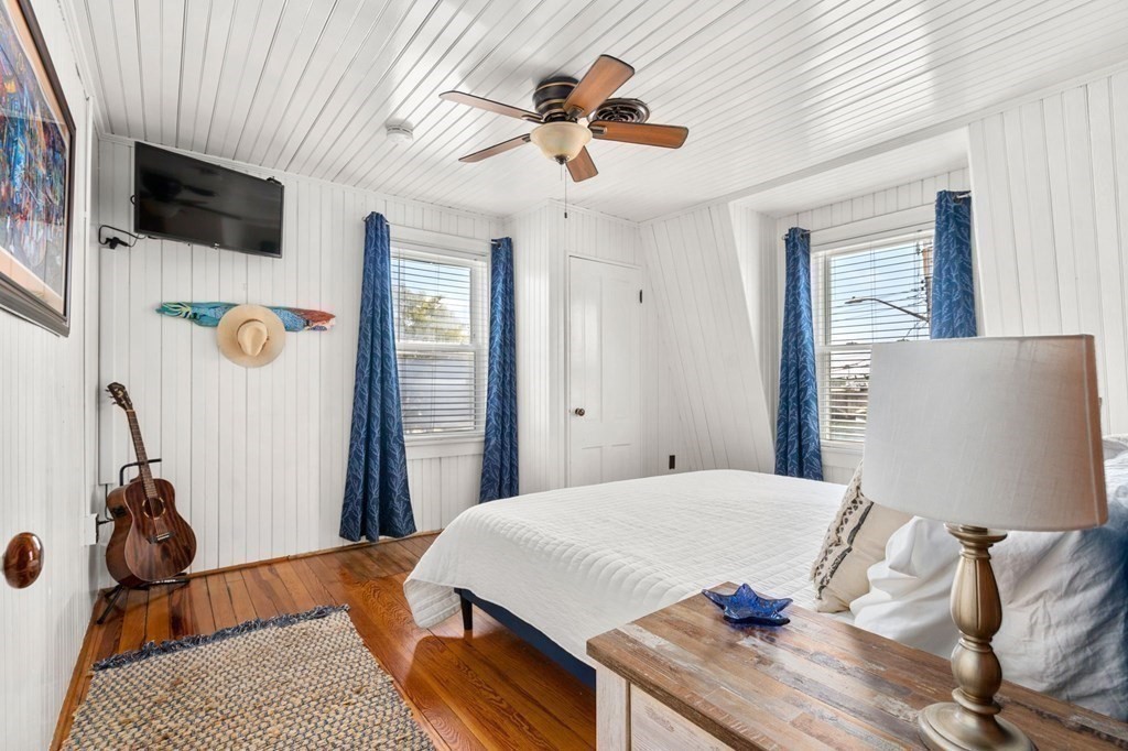 7 North Water Street Wareham, MA 02558 - Photo 19 of 39 a bedroom with a bed and a flat screen tv