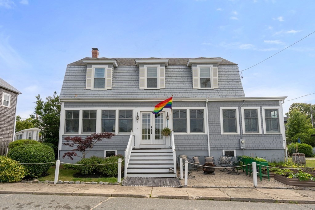 7 North Water Street Wareham, MA 02558 - Photo 2 of 39 a front view of a house with a yard