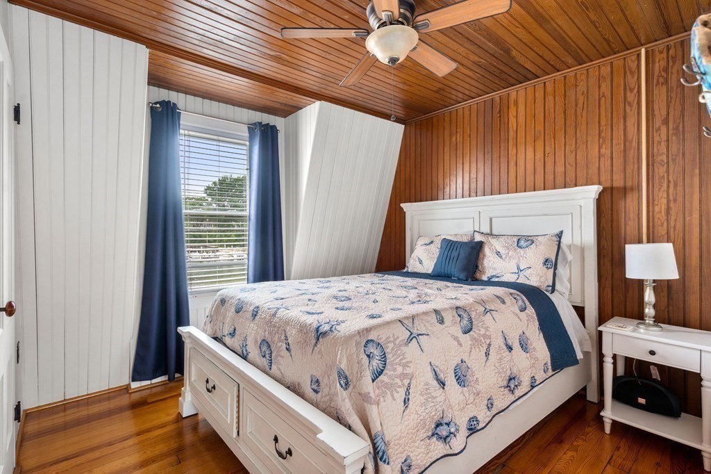 7 North Water Street Wareham, MA 02558 - Photo 23 of 39 a bed sitting in a bedroom next to a window