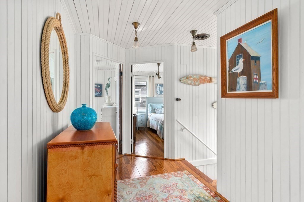 7 North Water Street Wareham, MA 02558 - Photo 25 of 39 a living room with furniture a mirror and a large window