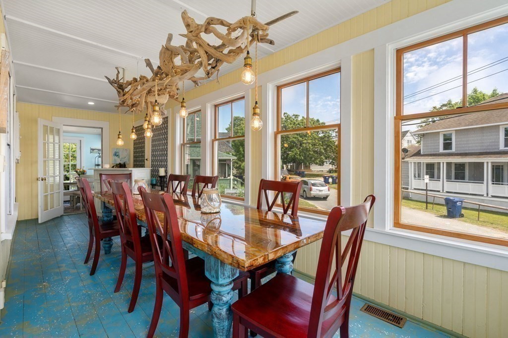 7 North Water Street Wareham, MA 02558 - Photo 6 of 39 a view of a dining room with furniture large windows and wooden floor