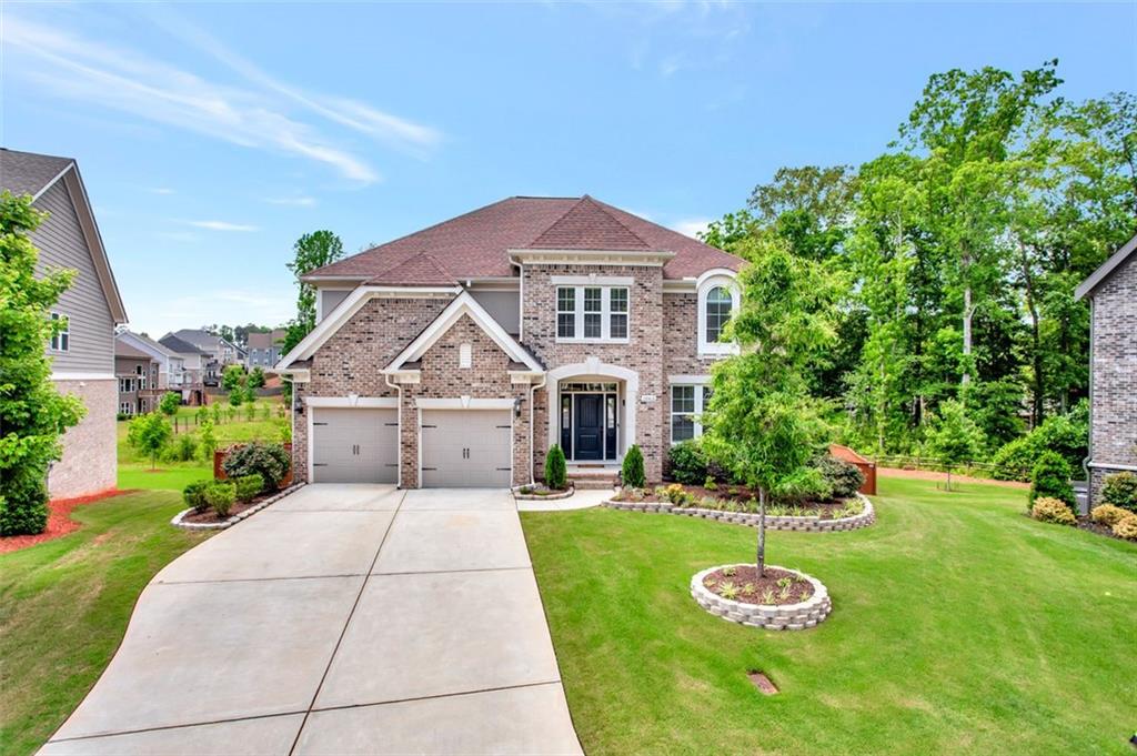 a front view of a house with a yard
