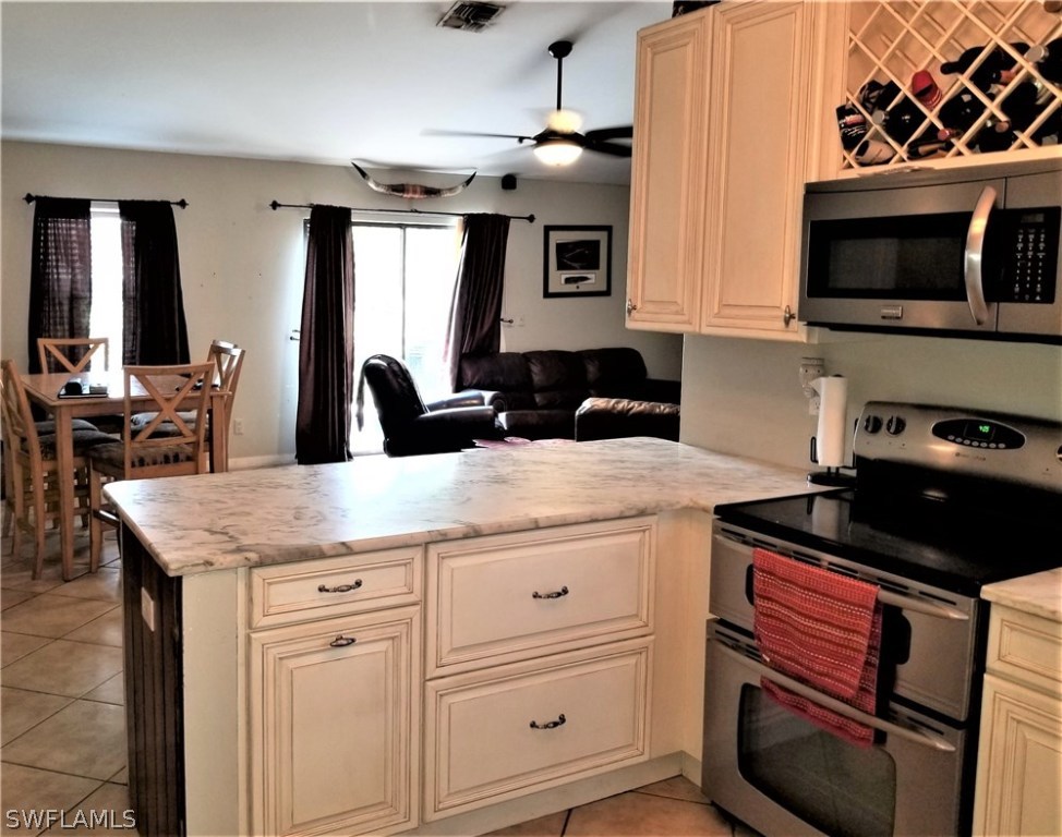 8201 Sandpiper Road Fort Myers, FL 33967 - Photo 5 of 11 a kitchen with a sink and cabinets