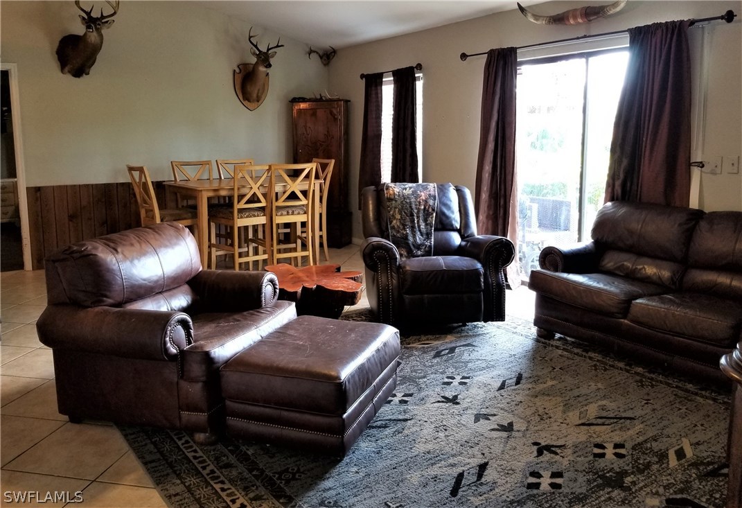 8201 Sandpiper Road Fort Myers, FL 33967 - Photo 7 of 11 a living room with furniture fireplace and window