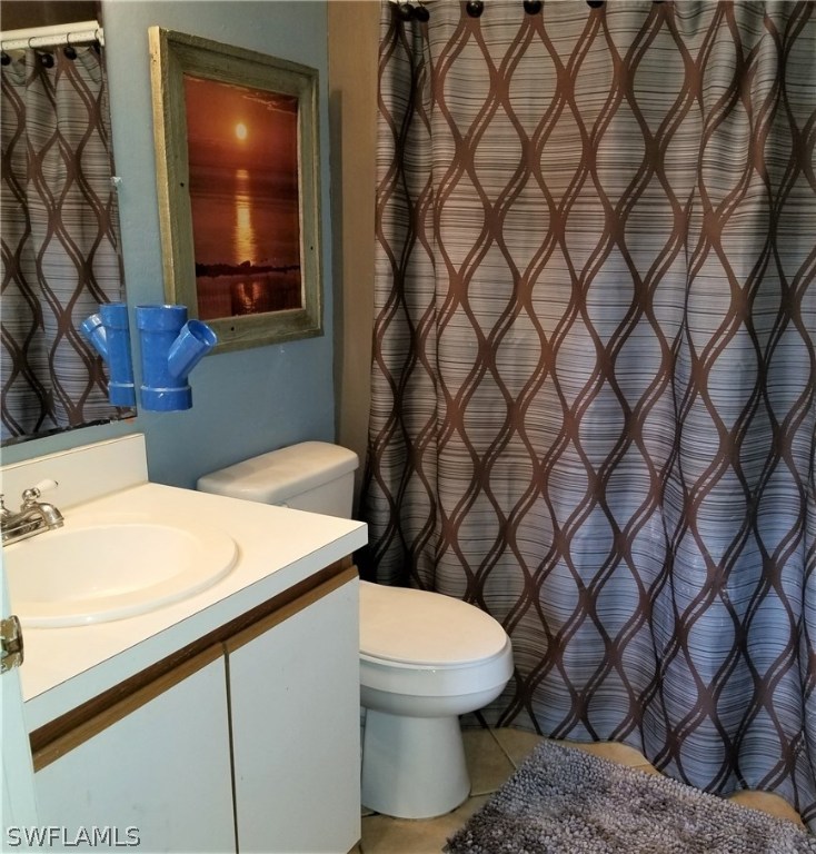 8201 Sandpiper Road Fort Myers, FL 33967 - Photo 9 of 11 a bathroom with a sink and a toilet