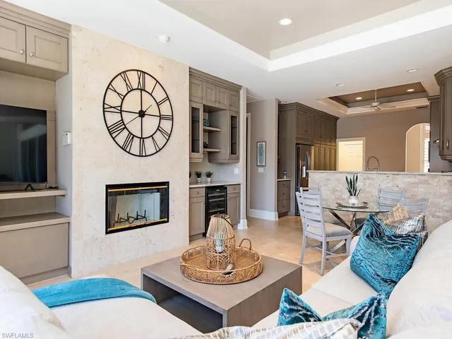 a living room with fireplace furniture and a fireplace