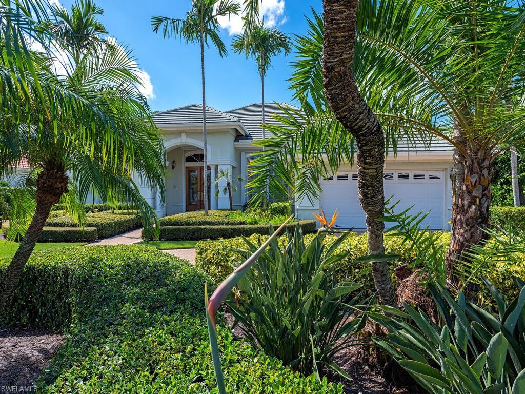 4459 Crayton Road Naples, FL 34103 - Photo 18 of 19 a view of a yard in front of house