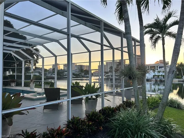 a view of a swimming pool with a patio