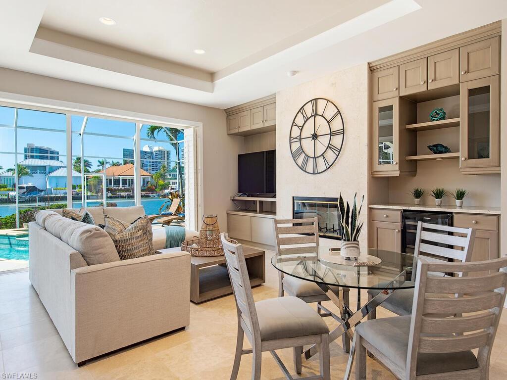 4459 Crayton Road Naples, FL 34103 - Photo 7 of 19 a view of a dining room with furniture window and outside view