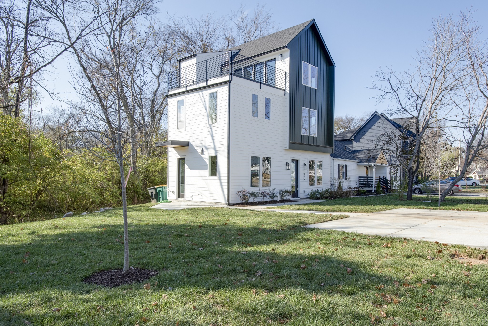 505 Croley Drive Nashville, TN 37209 - Photo 1 of 38 a view of a house with a big yard and large trees