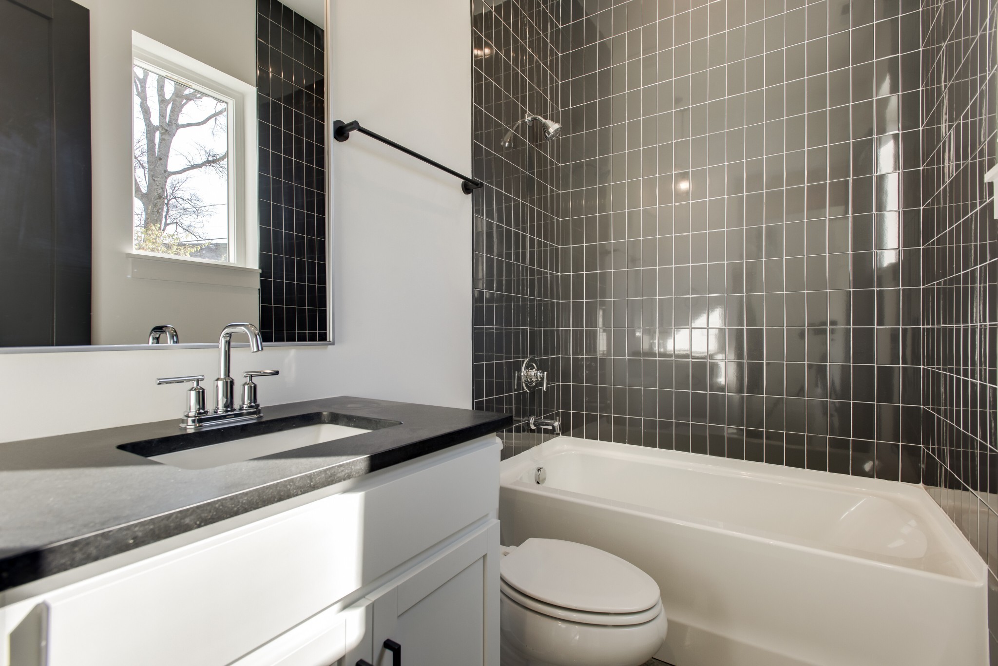 505 Croley Drive Nashville, TN 37209 - Photo 18 of 38 a bathroom with a granite countertop toilet a sink and bathtub