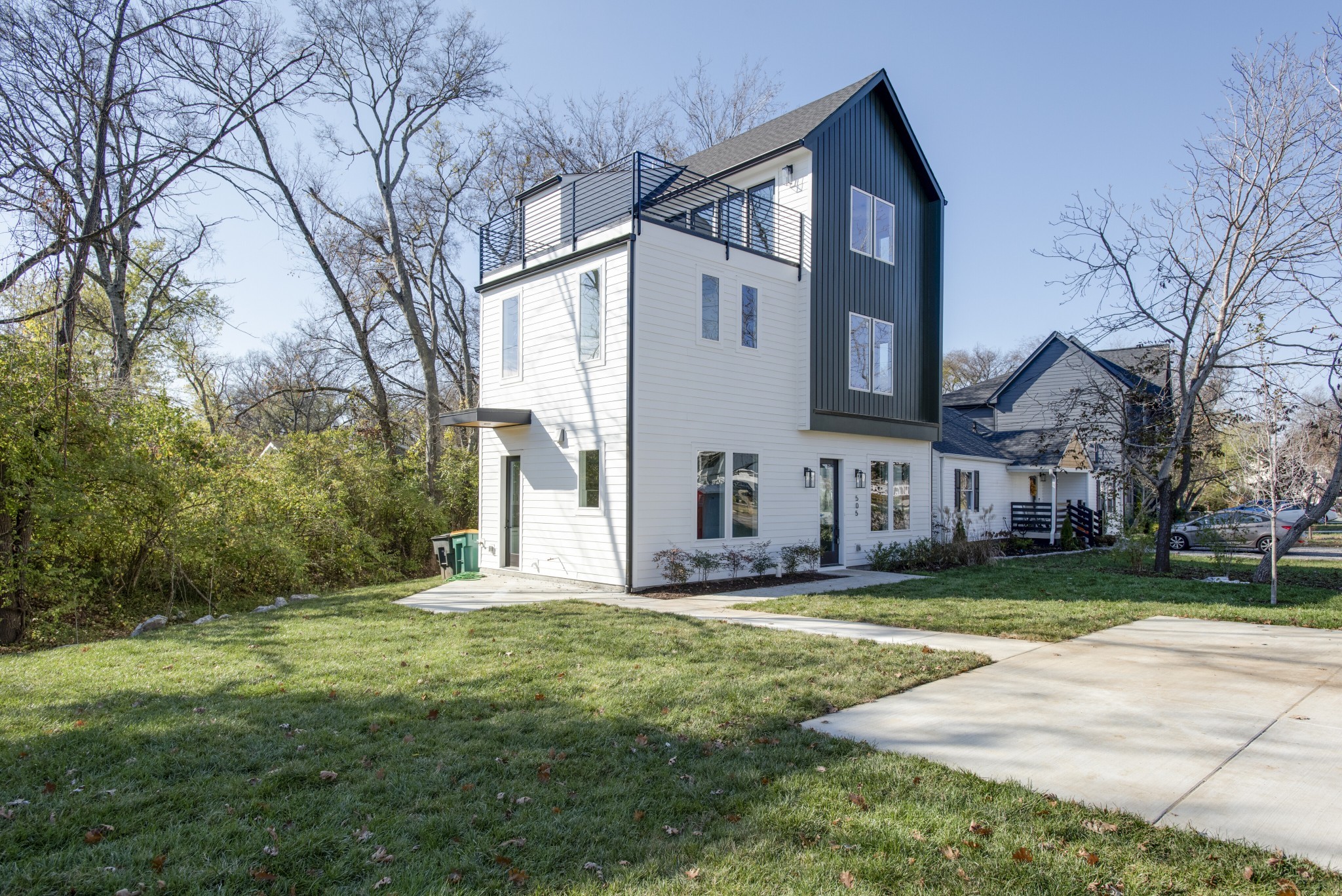 505 Croley Drive Nashville, TN 37209 - Photo 2 of 38 a view of a big house with a big yard and large trees