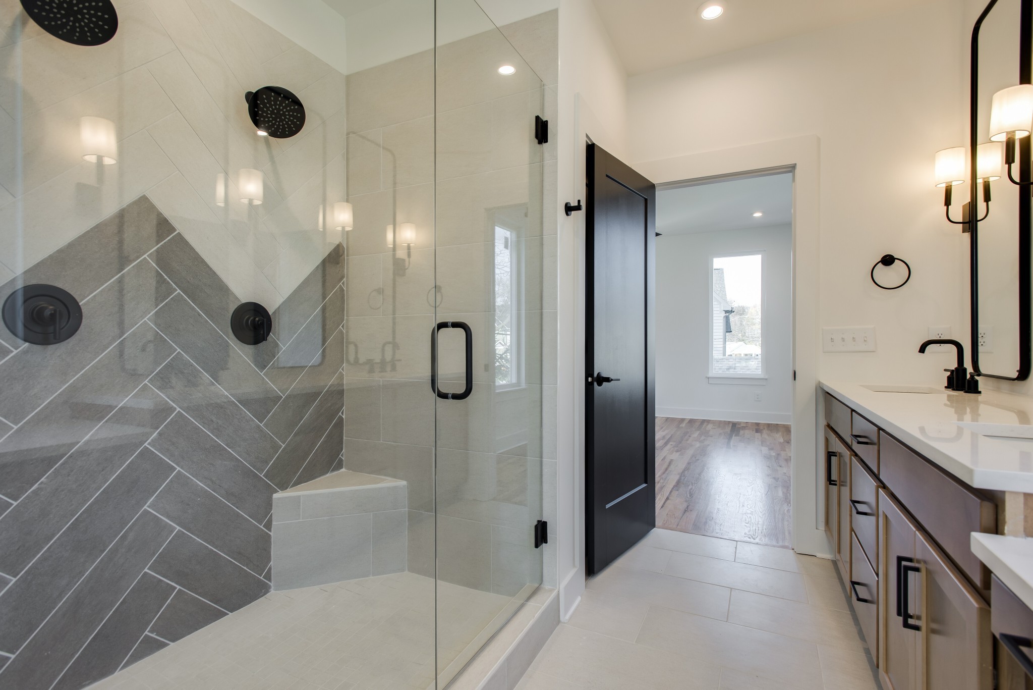 505 Croley Drive Nashville, TN 37209 - Photo 23 of 38 a bathroom with a double vanity sink a toilet a mirror and shower