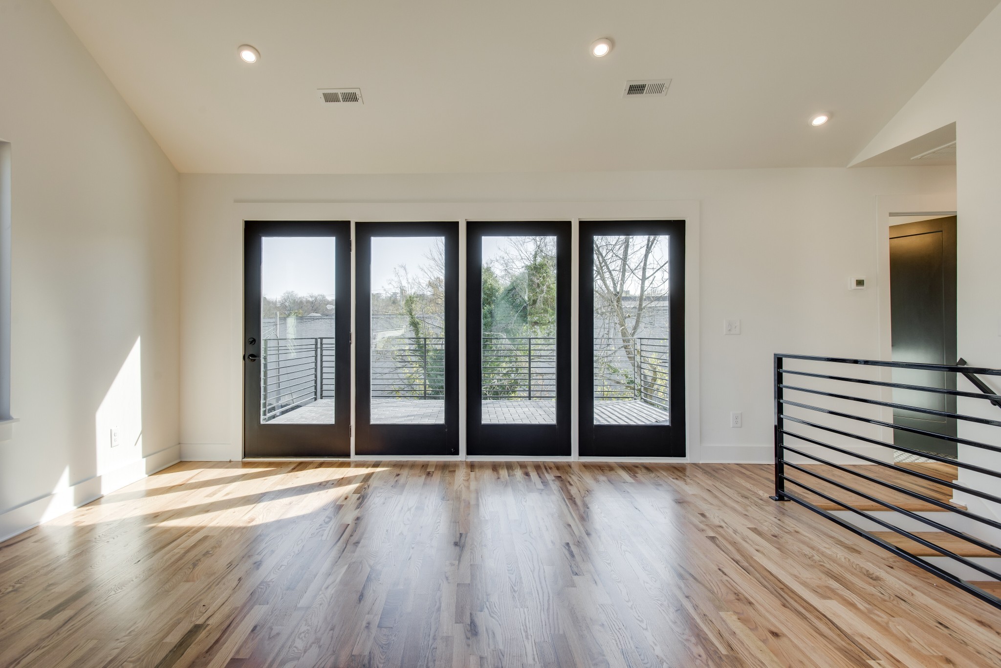 505 Croley Drive Nashville, TN 37209 - Photo 30 of 38 a view of an empty room with wooden floor and a window